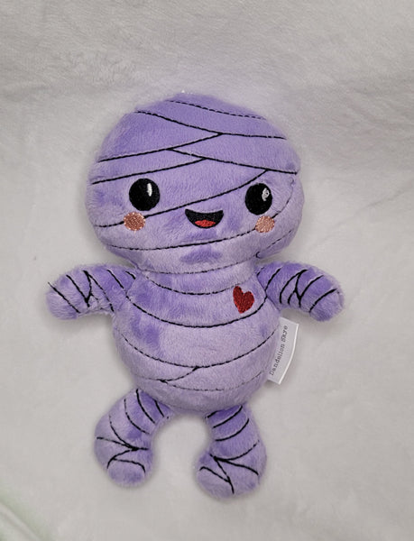 Purple mummy doll